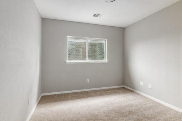 spare room with carpet flooring