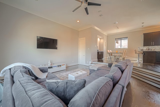 living room with ceiling fan, wood-type flooring, and crown molding