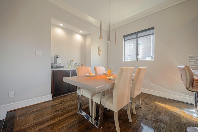 dining area with dark hardwood / wood-style flooring