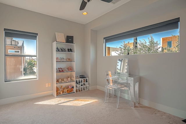 misc room featuring light colored carpet and ceiling fan