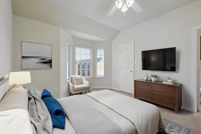 bedroom with ceiling fan, carpet, and lofted ceiling