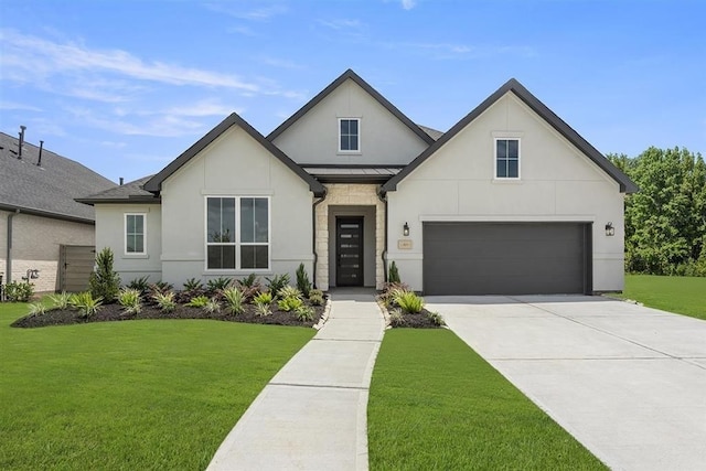 modern farmhouse featuring a front yard and a garage