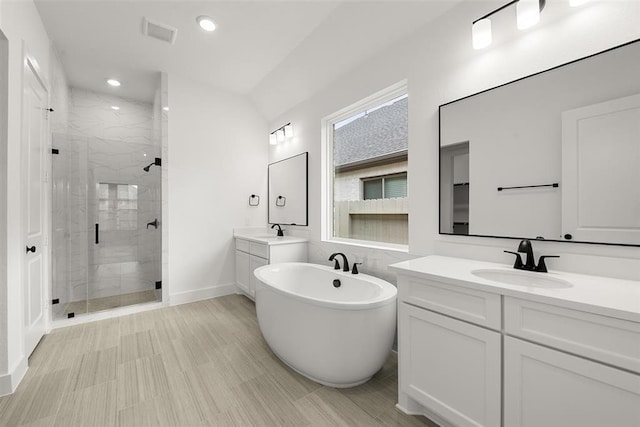 bathroom with vanity and plus walk in shower