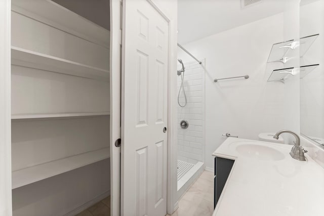 bathroom featuring vanity and walk in shower