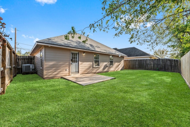 back of house featuring a lawn, central air condition unit, and a patio