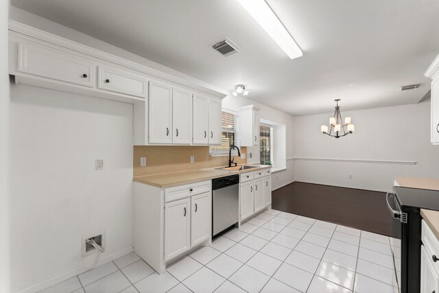 kitchen featuring white cabinets, sink, decorative light fixtures, dishwasher, and a chandelier