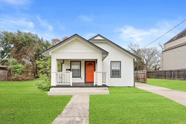 bungalow-style house featuring a front lawn and a porch