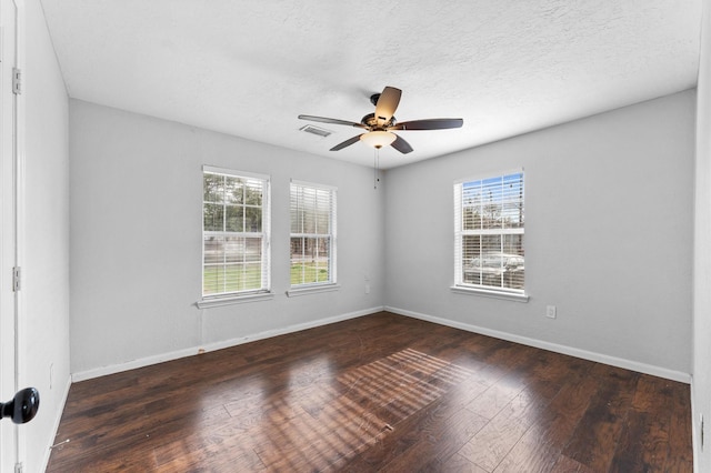 unfurnished room featuring dark hardwood / wood-style flooring and ceiling fan