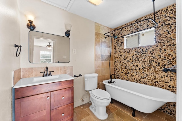 bathroom with ceiling fan, toilet, decorative backsplash, and vanity