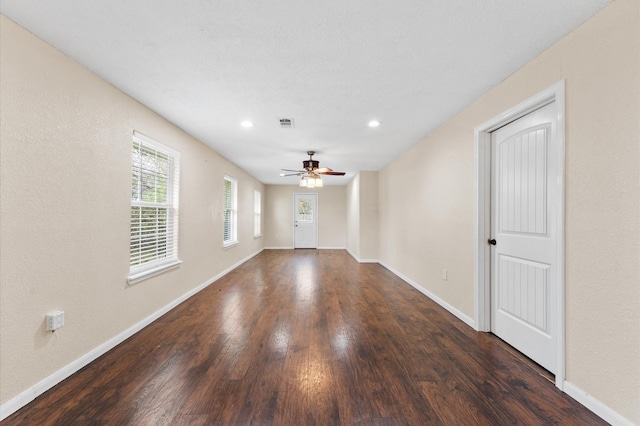 unfurnished living room featuring dark hardwood / wood-style flooring