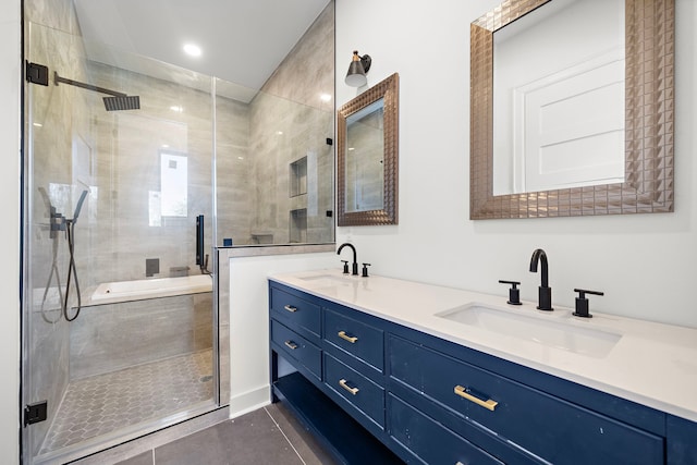 bathroom featuring tile patterned floors, vanity, and an enclosed shower