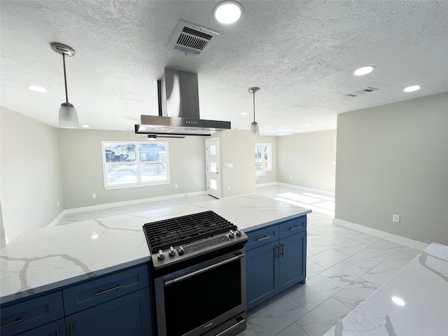 kitchen with hanging light fixtures, plenty of natural light, stainless steel gas range oven, and wall chimney exhaust hood