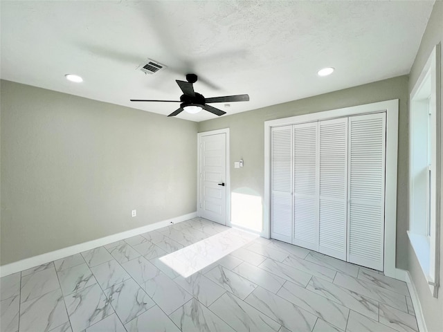 unfurnished bedroom featuring ceiling fan