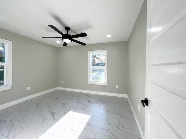 unfurnished room with ceiling fan