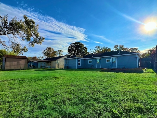 rear view of property with a yard