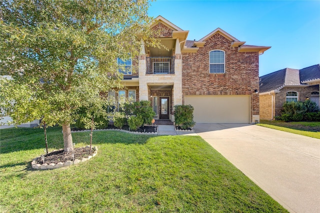 view of front of house featuring a balcony, a front yard, and a garage