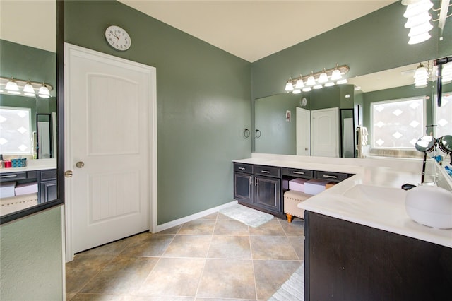 bathroom featuring tile patterned floors, a wealth of natural light, and vanity