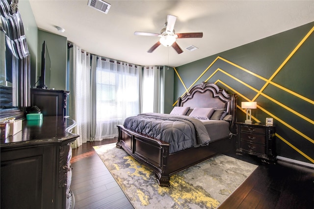 bedroom with ceiling fan and dark hardwood / wood-style flooring