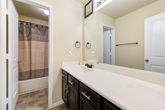 bathroom featuring tile patterned flooring, vanity, and shower / tub combo with curtain