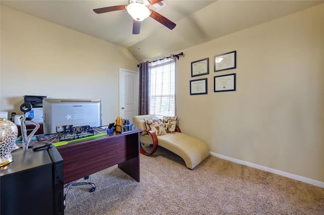 carpeted office with vaulted ceiling and ceiling fan