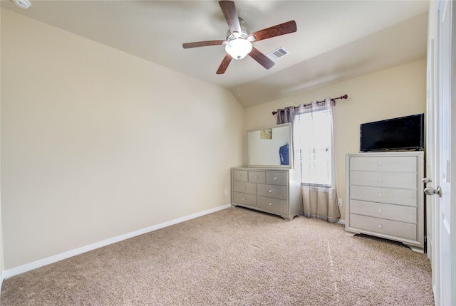 unfurnished bedroom with carpet flooring, ceiling fan, and lofted ceiling