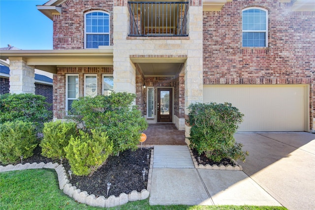 view of exterior entry with a garage