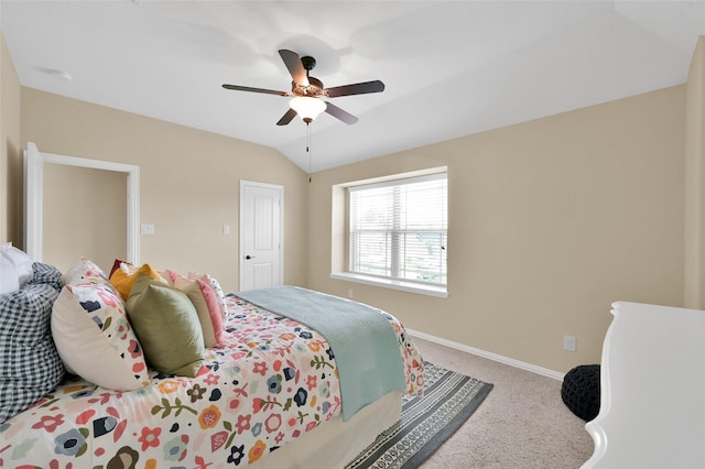 bedroom with lofted ceiling, ceiling fan, and carpet flooring