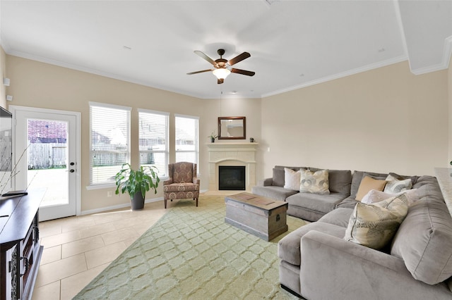 living room featuring light tile patterned floors, crown molding, and ceiling fan