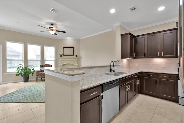 kitchen with sink, light tile patterned floors, dishwasher, light stone countertops, and kitchen peninsula