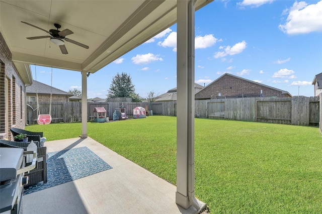 view of yard featuring a patio and ceiling fan