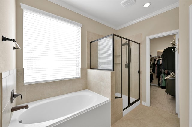 bathroom with independent shower and bath, ornamental molding, and tile patterned flooring