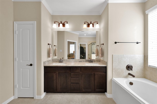 bathroom with crown molding, a wealth of natural light, tile patterned floors, and a bathtub