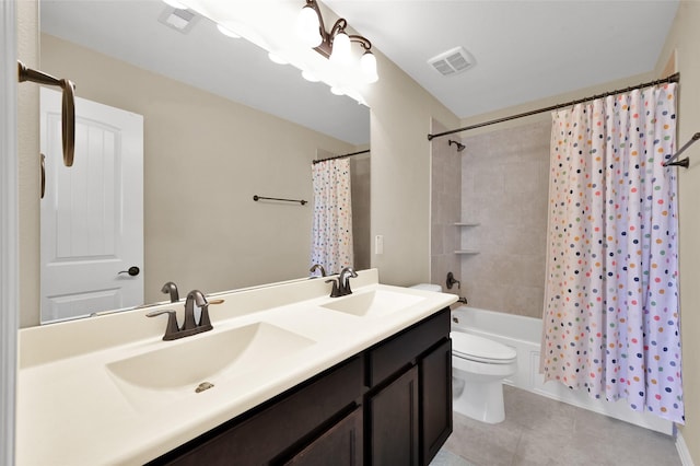 full bathroom with tile patterned floors, vanity, toilet, and shower / tub combo