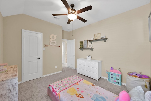 bedroom with vaulted ceiling, ceiling fan, and light colored carpet