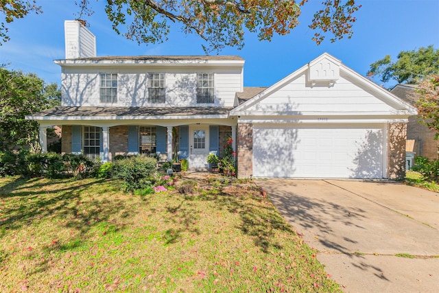 view of front facade with a garage and a front lawn