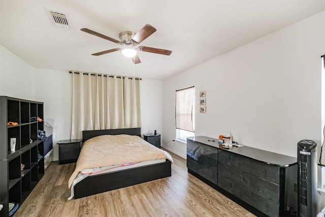 bedroom featuring ceiling fan and hardwood / wood-style flooring