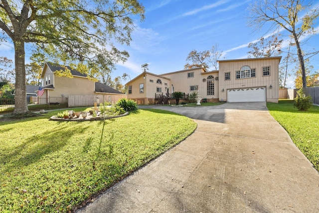 view of front facade with a garage and a front lawn