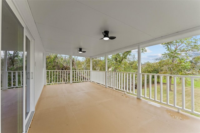 exterior space with ceiling fan and a porch