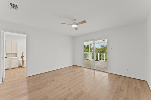 spare room featuring ceiling fan and light hardwood / wood-style flooring