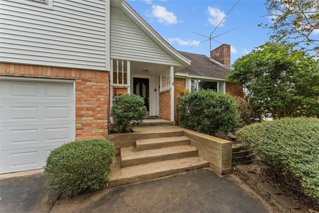 property entrance with a garage