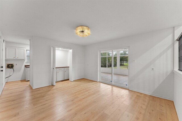 unfurnished living room with light hardwood / wood-style flooring