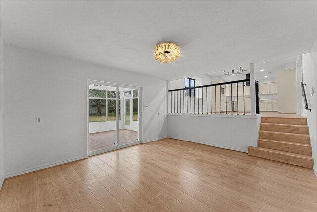 unfurnished living room with light wood-type flooring