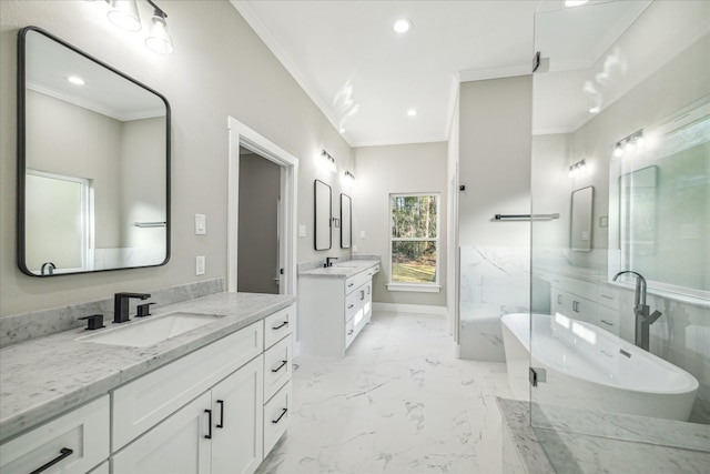 bathroom featuring marble finish floor, two vanities, ornamental molding, and a sink