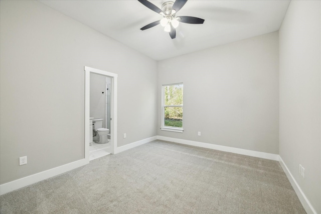 spare room with carpet floors and ceiling fan