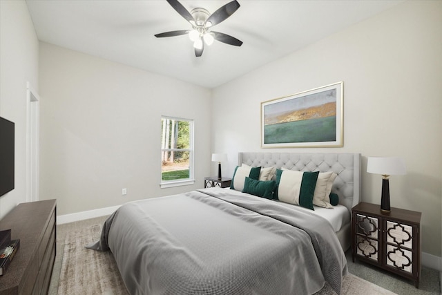 bedroom featuring ceiling fan and light carpet