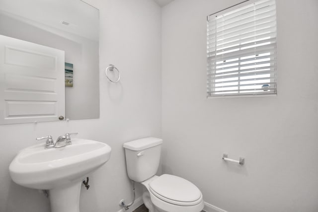 bathroom featuring sink and toilet