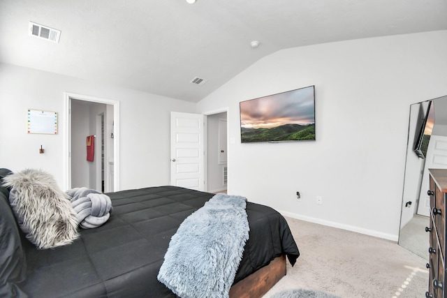 bedroom with carpet flooring and lofted ceiling