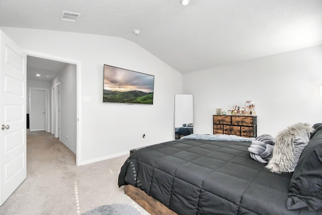 bedroom with light carpet and vaulted ceiling