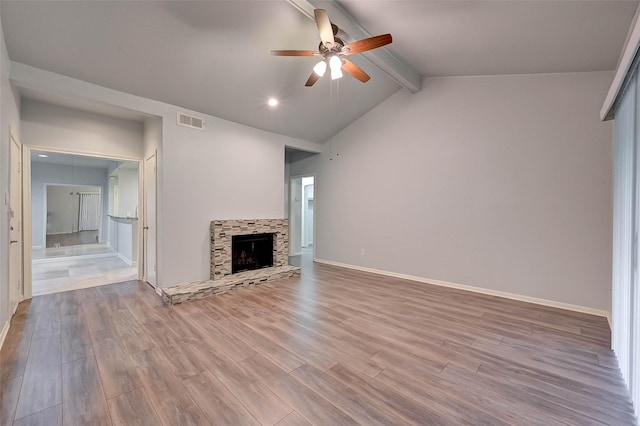 unfurnished living room with vaulted ceiling with beams, ceiling fan, and light hardwood / wood-style floors