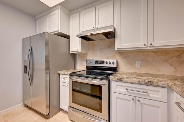 kitchen featuring light stone counters, white cabinetry, stainless steel appliances, and tasteful backsplash